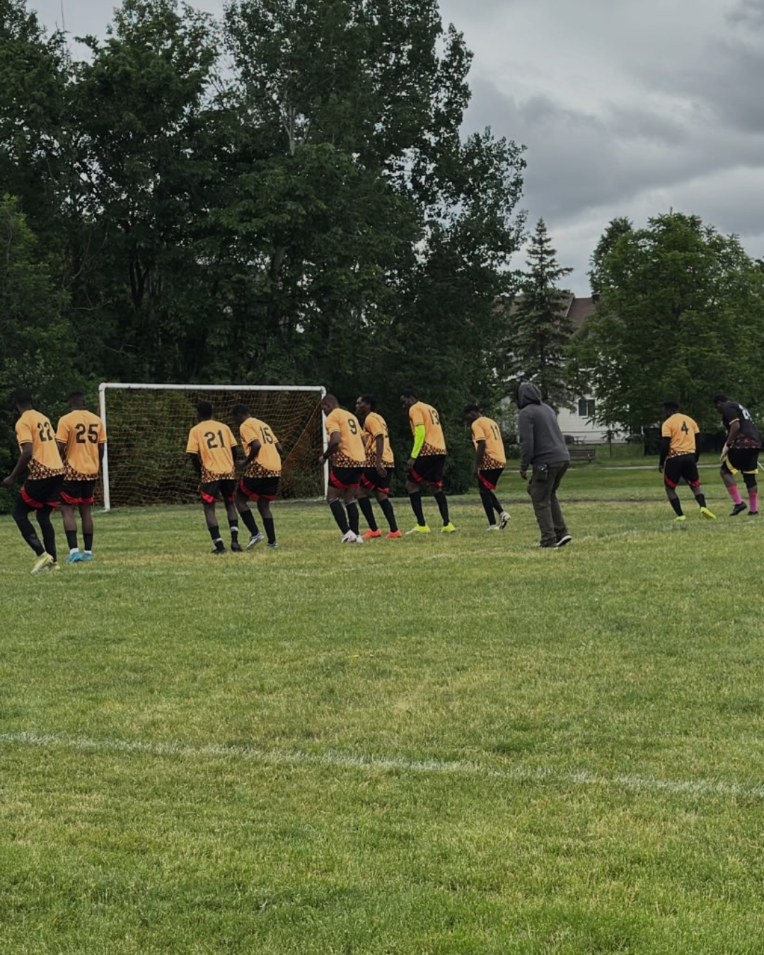 B6 Global Network players and staff during an international training camp on an outdoor pitch