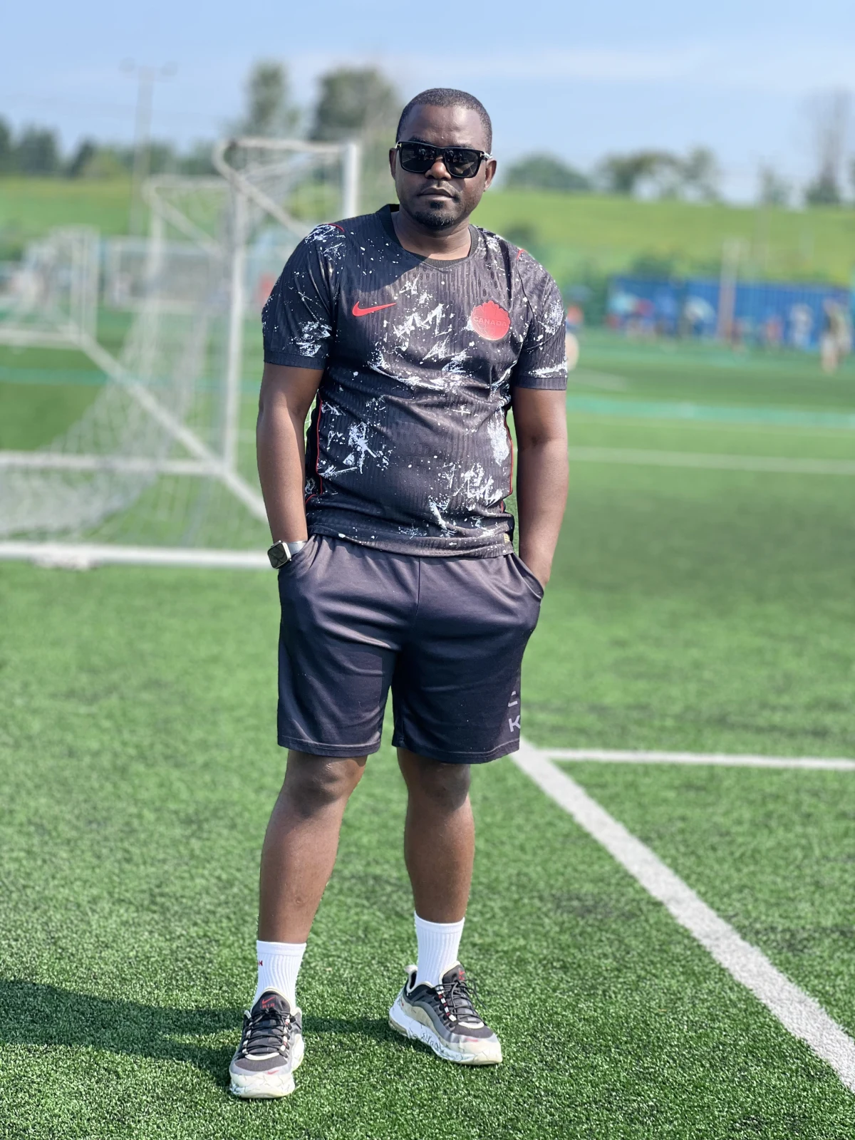 Baker Kigongo portrait on a football pitch, founder of B6 Global Network